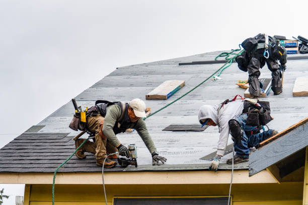 Professional Roofing technician working in East Nassau, NY